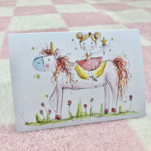 Girl Riding Pink Unicorn Greetings Card